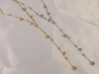 Collar de acero con esferas bañado en oro 18K