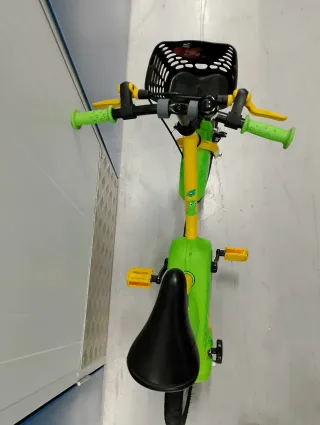 Bicicleta Btwin 14 verde y amarilla