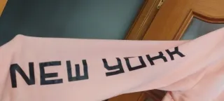 Sudadera rosa con cremallera y capucha