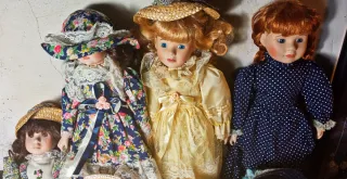 Lotto 7 bambole ceramica