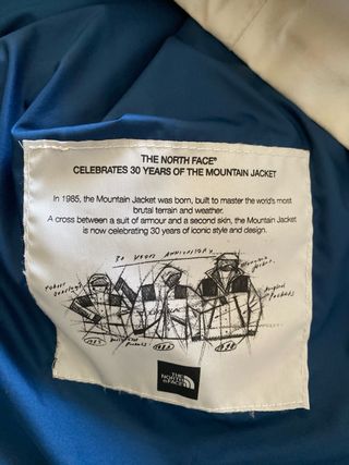 Chubasquero The North Face azul y blanco