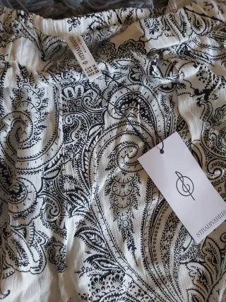 Pantalón fluido palazzo. Talla M. Stradivarius