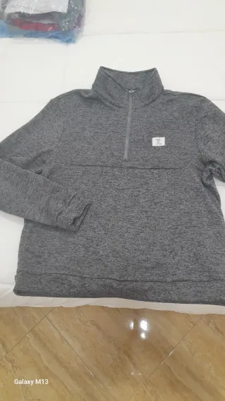 Sudadera gris hombre cuello alto cremallera