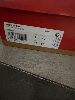 Scarpe da calcio Puma nere e arancioni