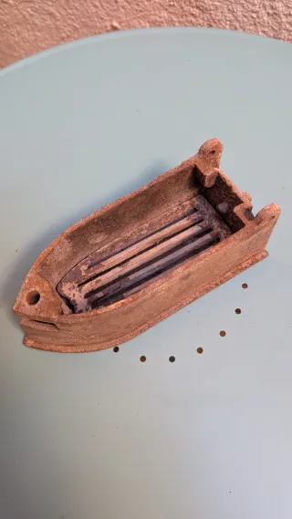 Plancha antigua de hierro fundido