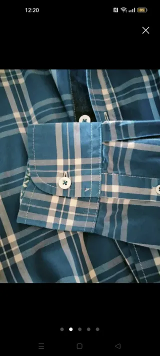 Camisa de cuadros azul y blanca Talla S. El corte