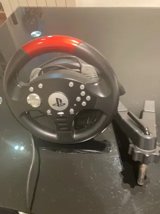 PS3 con volante, 2 mandos y 3 juegos