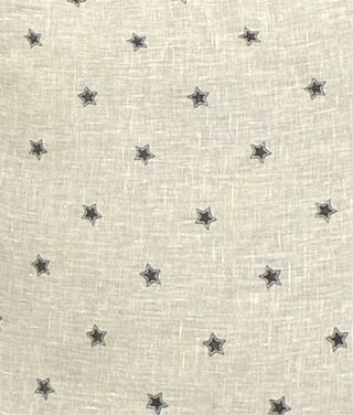 Cojín Zara Home estrellas gris doble cara.