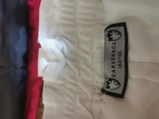 Traje de esquí infantil rosa y blanco