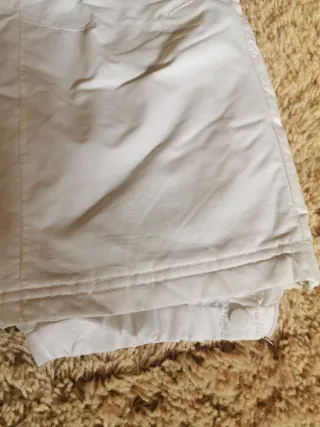 Traje de esquí infantil rosa y blanco