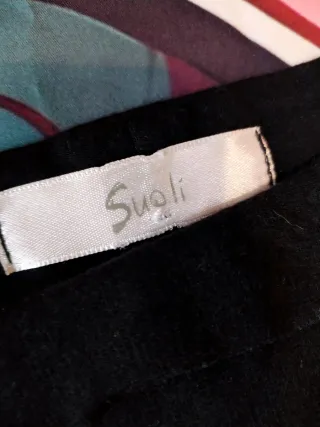 Abito neroin misto lana con volant