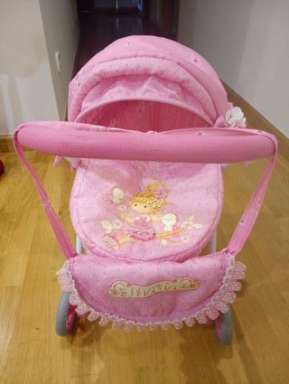 Carrito de muñecas rosa con bolso