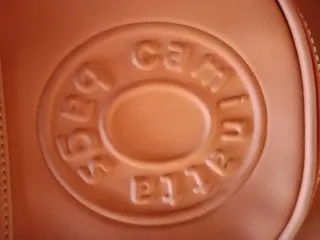 Mochila bandolera naranja impermeable nueva