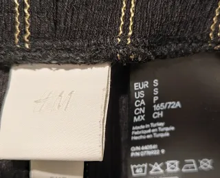 Pantalón H&M pinzas rayas doradas.