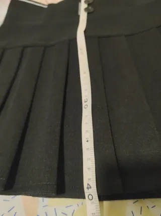 Minifalda negra plisada