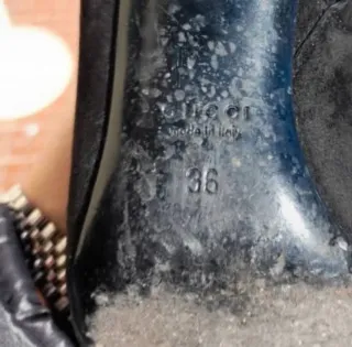 Stivali Gucci neri con borchie oro