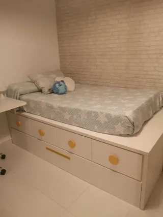 Cama nido con cajones armario y mesa de estudio.
