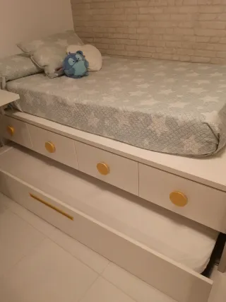 Cama nido con cajones armario y mesa de estudio.