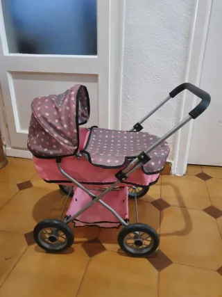 Cochecito de muñecas rosa lunares