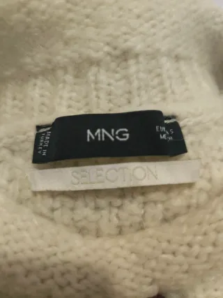 Jersey de punto trenzado cuello alto