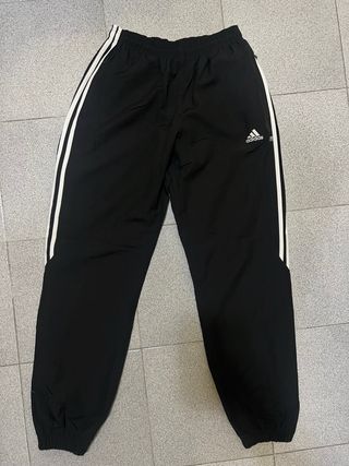 Tuta Adidas nera con bande laterali