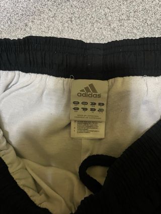 Tuta Adidas nera con bande laterali