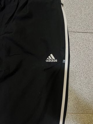 Tuta Adidas nera con bande laterali