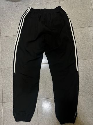 Tuta Adidas nera con bande laterali