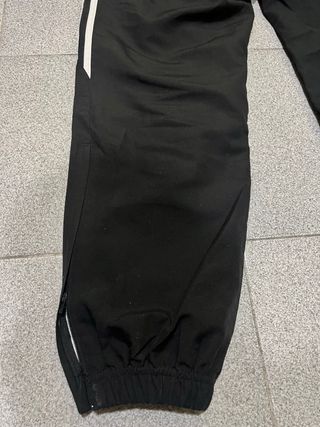 Tuta Adidas nera con bande laterali