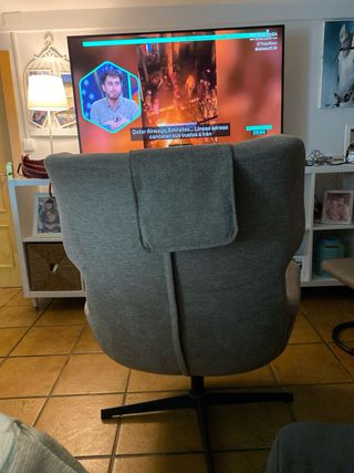 Sillón giratorio tapizado gris