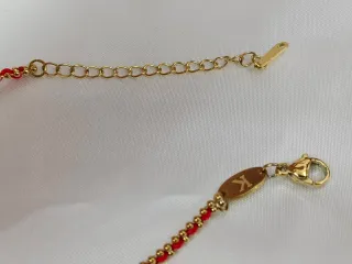Pulsera Acero Dorado y cuerda Rojo oro bañado