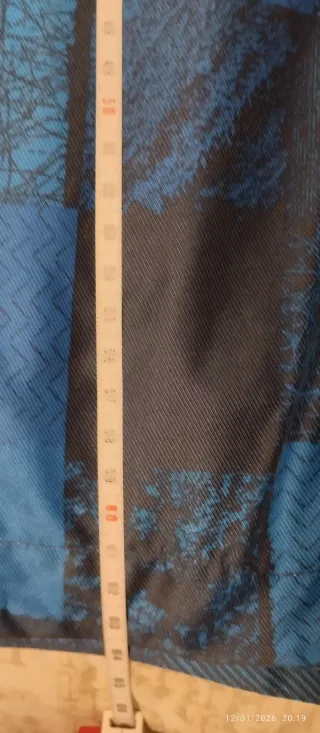 Anorak McKinley niño azul y negro Talla 14 años