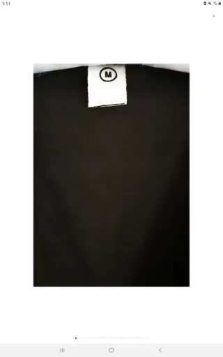 Chaleco bordado de loros y flores