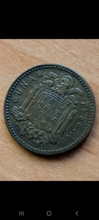 1 Peseta