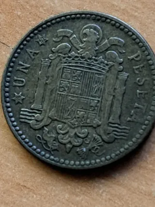 1 Peseta