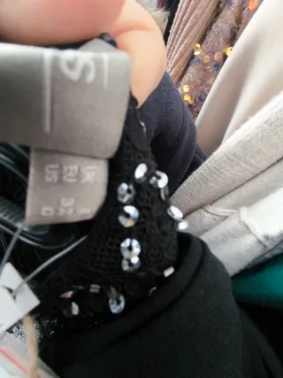 Mono elegante lentejuelas y pantalón negro