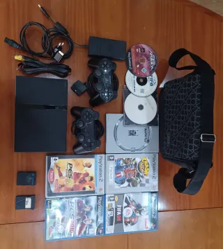 Consola PS2 com 2 comandos e 8 jogos