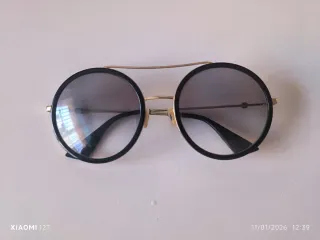 Gafas de sol Gucci negras y doradas