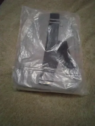 Mochila bandolera hombre gris