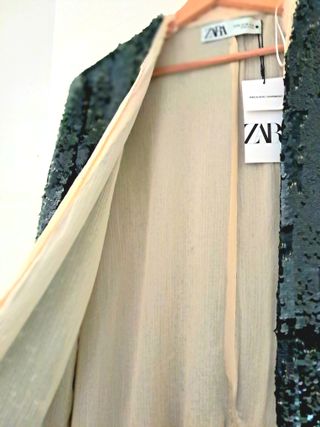 Chaqueta con lentejuelas en verde oscuro forrada