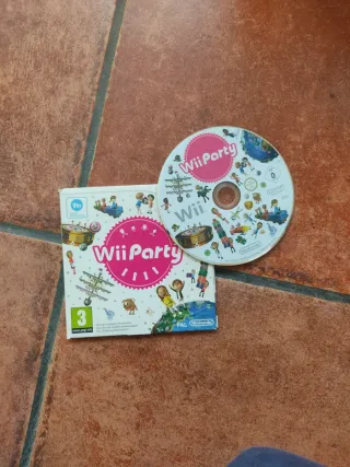 Nintendo Wii con micrófonos,  mandos y 6 juegos