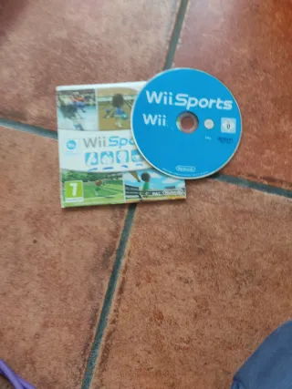 Nintendo Wii con micrófonos,  mandos y 6 juegos