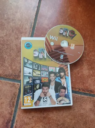 Nintendo Wii con micrófonos,  mandos y 6 juegos