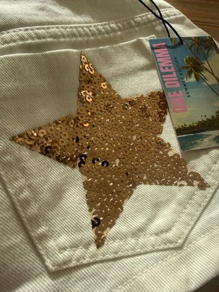 Minifalda One Dilemma blanca estrellas lentejuelas