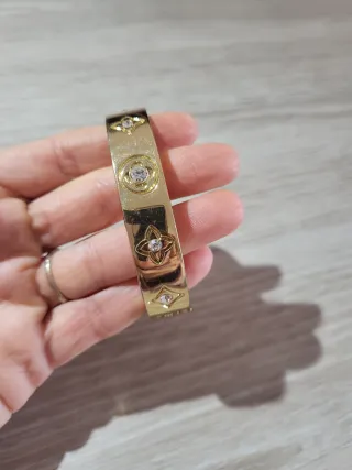 Pulsera rígida dorada cristales