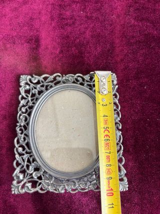 Marco de fotos ovalado de metal