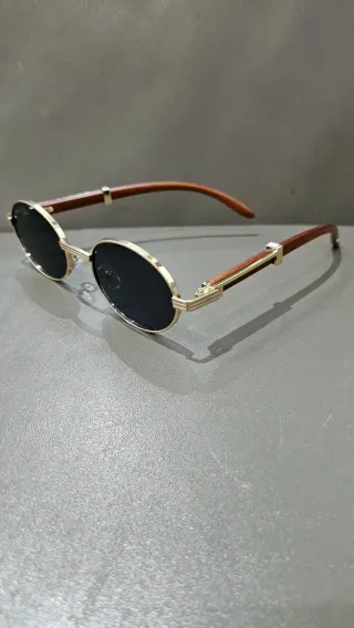 Gafas de sol ovaladas doradas y marrones