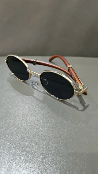 Gafas de sol ovaladas doradas y marrones