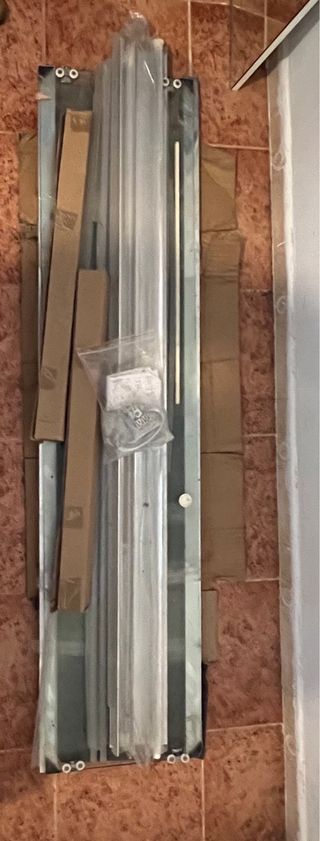 Puerta de ducha de cristal y metal