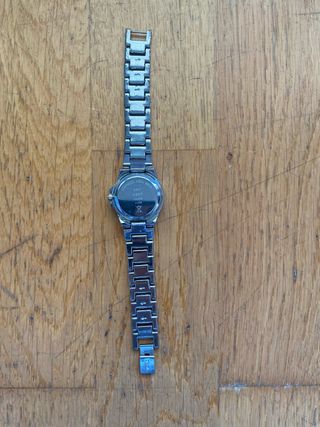 Reloj Next plateado con diamantes